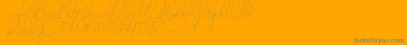 Diamante Signature Italic  -Schriftart – Graue Schriften auf orangefarbenem Hintergrund