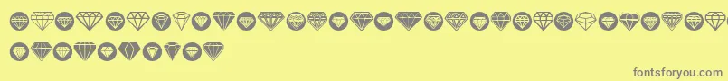 Diamondo-fontti – harmaat kirjasimet keltaisella taustalla
