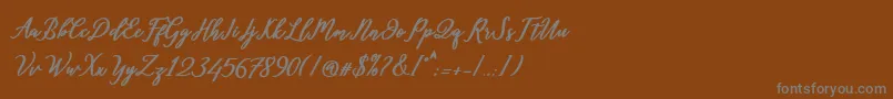 フォントDiantha – 茶色の背景に灰色の文字