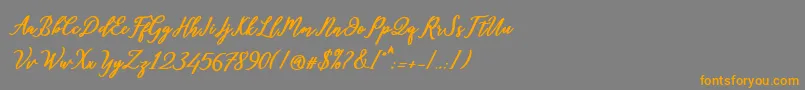 フォントDiantha – オレンジの文字は灰色の背景にあります。