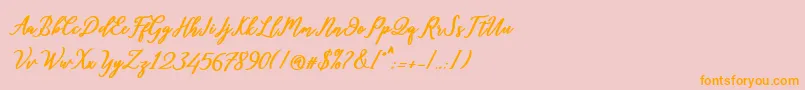 フォントDiantha – オレンジの文字がピンクの背景にあります。