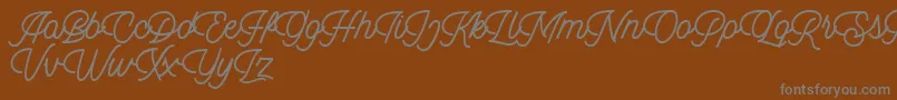 Dingbod script FREE-Schriftart – Graue Schriften auf braunem Hintergrund