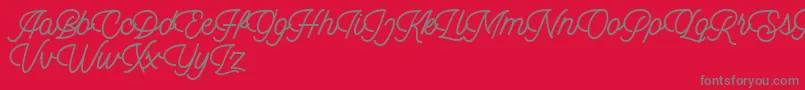 Dingbod script FREE-Schriftart – Graue Schriften auf rotem Hintergrund