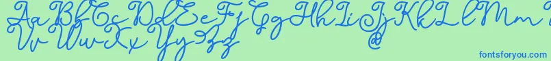 Dinila Script DAFONT-Schriftart – Blaue Schriften auf grünem Hintergrund