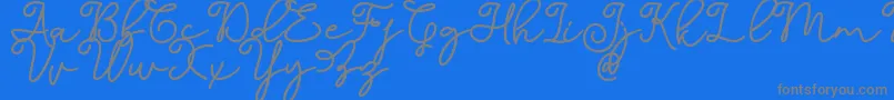 フォントDinila Script DAFONT – 青い背景に灰色の文字