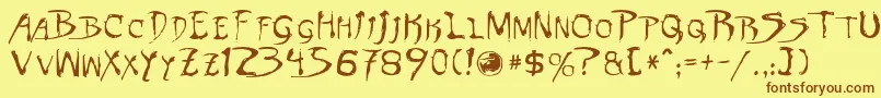 フォントDinobots – 茶色の文字が黄色の背景にあります。