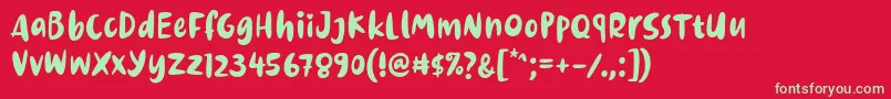 フォントDinomiko Font by 7NTypes – 赤い背景に緑の文字