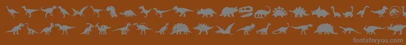 Dinosaur Icons-fontti – harmaat kirjasimet ruskealla taustalla