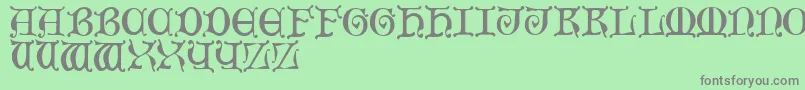 MediaevalCaps Font – Gray Fonts on Green Background