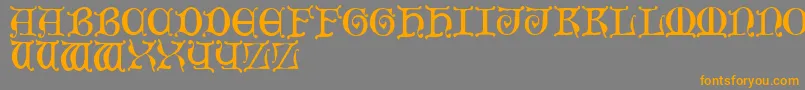 MediaevalCaps-Schriftart – Orangefarbene Schriften auf grauem Hintergrund