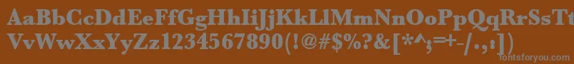 Urwbaskertultbolnar-fontti – harmaat kirjasimet ruskealla taustalla