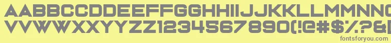 フォントDispence – 黄色の背景に灰色の文字