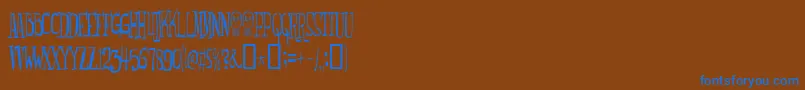 Monsterfreak Font – Blue Fonts on Brown Background