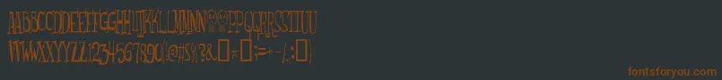 Monsterfreak-fontti – ruskeat fontit mustalla taustalla