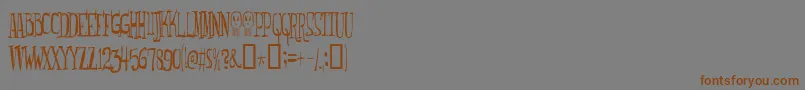 Подробнее о шрифте Monsterfreak Шрифт Monsterfreak – коричневые шрифты на сером фоне
