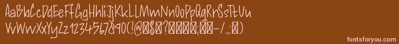 フォントDK Andorra Script – 茶色の背景にピンクのフォント