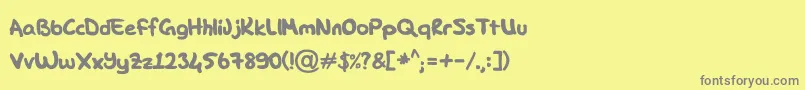 フォントDK Hand – 黄色の背景に灰色の文字