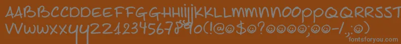 DK Joe Schmoe-fontti – harmaat kirjasimet ruskealla taustalla