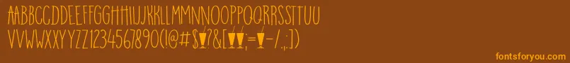 Шрифт DK Mango Smoothie – оранжевые шрифты на коричневом фоне