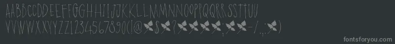 DK Poison Ivy-fontti – harmaat kirjasimet mustalla taustalla