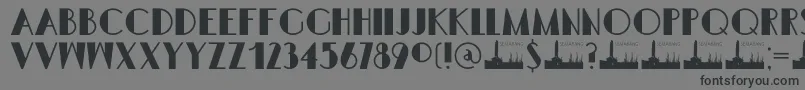 Шрифт DK Semarang Kolonial – чёрные шрифты на сером фоне