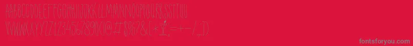 DK Shaken Not Stirred-fontti – harmaat kirjasimet punaisella taustalla
