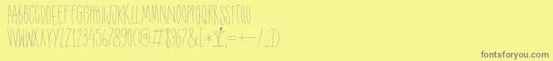 DK Shaken Not Stirred-Schriftart – Graue Schriften auf gelbem Hintergrund