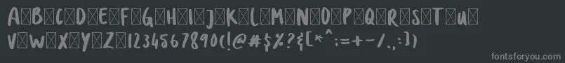 DOLANAN-fontti – harmaat kirjasimet mustalla taustalla