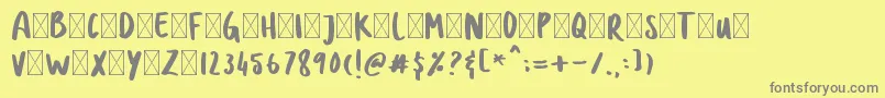 DOLANAN-fontti – harmaat kirjasimet keltaisella taustalla