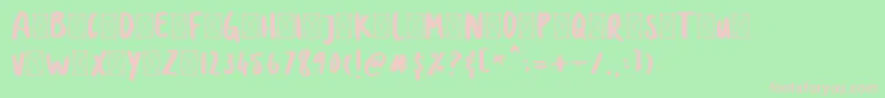フォントDOLANAN – 緑の背景にピンクのフォント