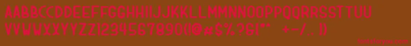 フォントdologan bold – 赤い文字が茶色の背景にあります。
