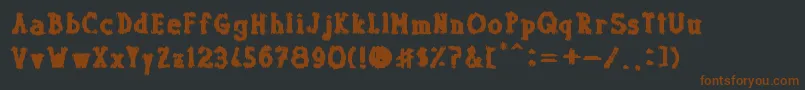 Dolor de Muelas-fontti – ruskeat fontit mustalla taustalla