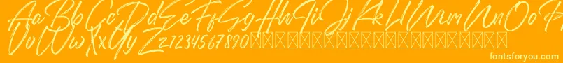 Czcionka DomillionBrushFree – żółte czcionki na pomarańczowym tle