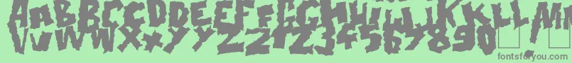 Doonga Black-fontti – harmaat kirjasimet vihreällä taustalla