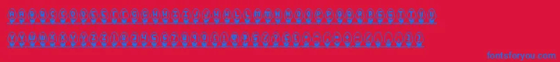 Fonte XmasLightsBrk – fontes azuis em um fundo vermelho