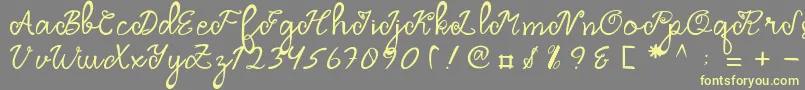 フォントDragonfly Script – 黄色のフォント、灰色の背景