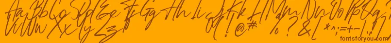 Dreaming-Schriftart – Braune Schriften auf orangefarbenem Hintergrund