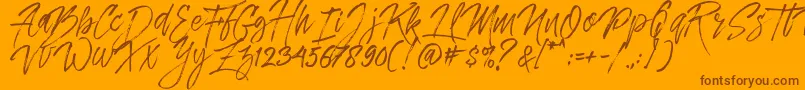 Czcionka Dreamlight Typeface Free Demo – brązowe czcionki na pomarańczowym tle