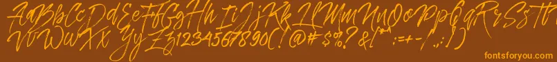 Dreamlight Typeface Free Demo-Schriftart – Orangefarbene Schriften auf braunem Hintergrund