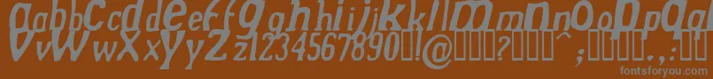 DREKNI  -fontti – harmaat kirjasimet ruskealla taustalla