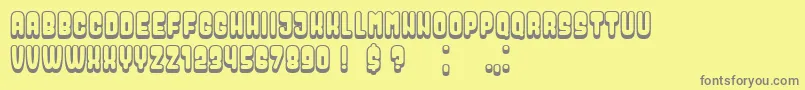 Dressed-fontti – harmaat kirjasimet keltaisella taustalla