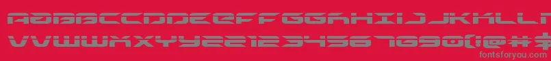 drivelaser-Schriftart – Graue Schriften auf rotem Hintergrund