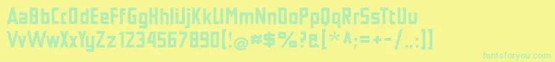 TschicholdBold-Schriftart – Grüne Schriften auf gelbem Hintergrund