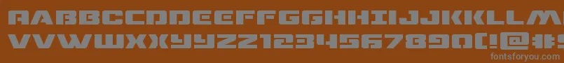 dronetrackerexpand-Schriftart – Graue Schriften auf braunem Hintergrund