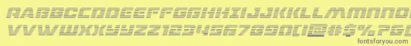 フォントdronetrackergradital – 黄色の背景に灰色の文字