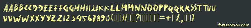 フォントDryMakerXXS – 黒い背景に黄色の文字