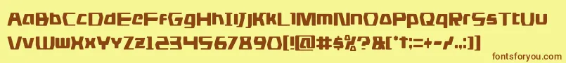 フォントdsmancond – 茶色の文字が黄色の背景にあります。