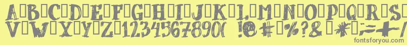 DUBBEL  -fontti – harmaat kirjasimet keltaisella taustalla