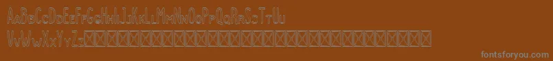 Шрифт Dutchy Outline – серые шрифты на коричневом фоне