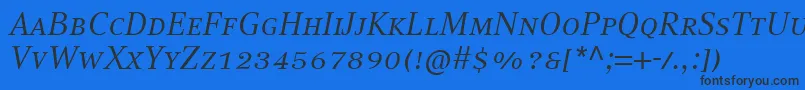 フォントCompatilTextLtComItalicSmallCaps – 黒い文字の青い背景